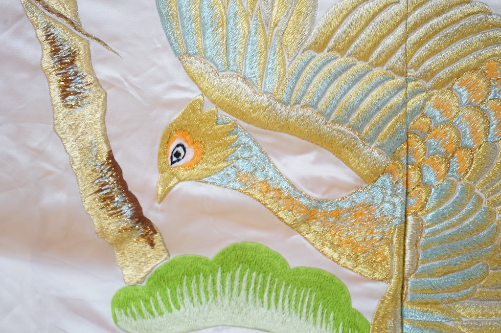 A late 20th century polychrome silk and metallic embroidered Japanese kimono, 133cm long. Condition - the silk is stained in places, which may be able to be cleaned.